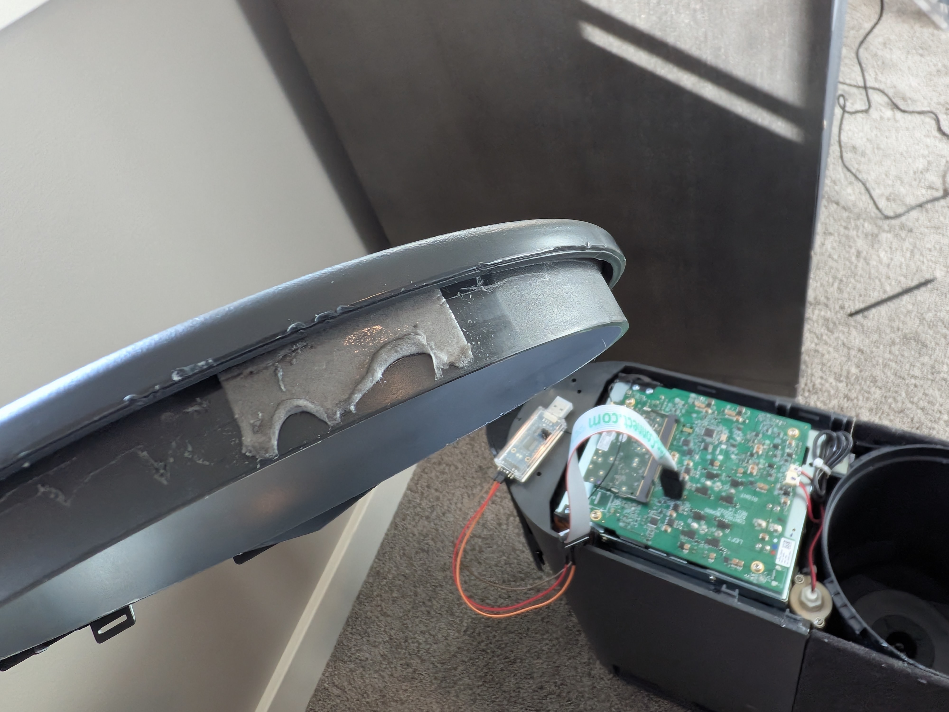 Adhesive on the front grill cover of the Eight Sleep Pod